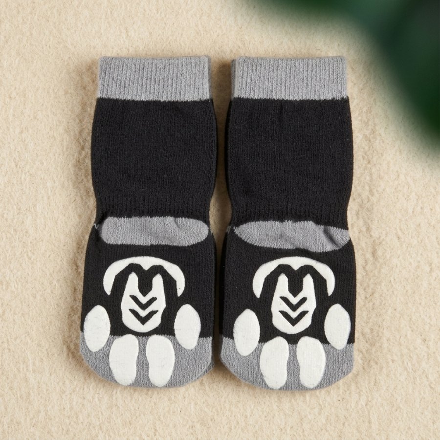 Flat-lay of Non-Slip Paw Grip Socks showing the full set and adjustable straps